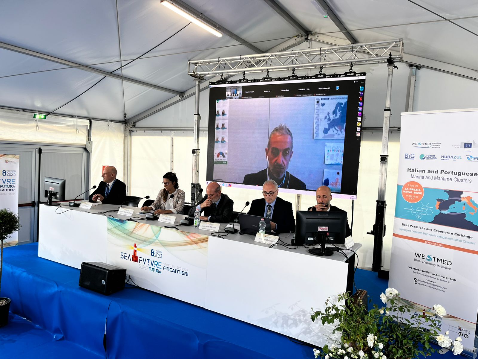 Maritime Clusters workshop at SeaFuture 2023 with speakers at table in a conference room